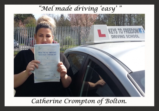 Catherine Crompton poses with her certificate after passing her driving test with Keys to Freedom Driving School Bolton.