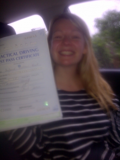 Proudly holding her Pass Certificate A great drive in heavy rain hence the picture taken in the car