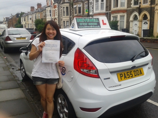 Proudly holding her Pass Certificate