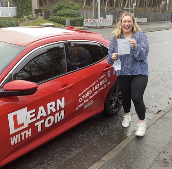 Caitlin learned to drive with the help of Tom