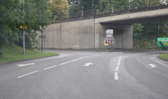 Use the road markings Get across to the left lane to exit or middle to follow round